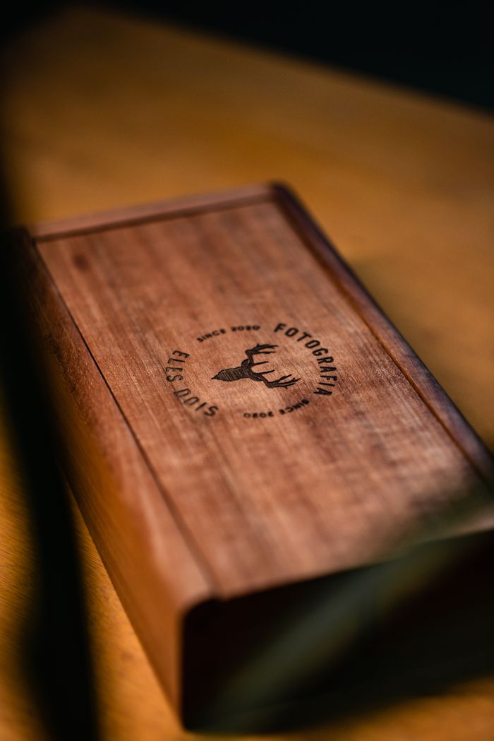 services-01 Stylish wooden box featuring an engraved logo, perfect for display or gift packaging.