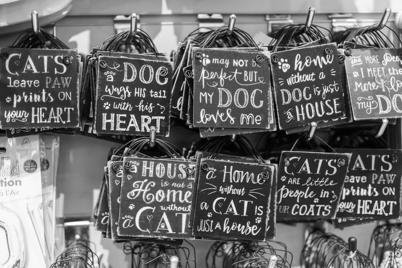 services-img Monochrome image of various pet-themed quote signs, perfect for animal lovers.