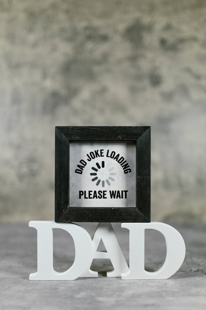 Black wooden frame with a humorous dad joke for Father's Day gifts.